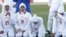 Players for Iran's women's national soccer team react after the disqualification announcement in Amman, Jordan, on June 3.