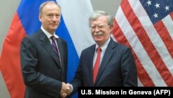 U.S. national-security adviser John Bolton (right) shakes hands with Russian counterpart Nikolai Patrushev during a meeting at the U.S. Mission in Geneva in August.