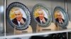Souvenir plates featuring a portrait of former President Islam Karimov on sale in Samarkand (file photo)