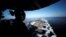 A U.S sailor keeps watch from the captain's bridge onboard the USS John C. Stennis as it makes its way to the Gulf through the Strait of Hormuz, December 21, 2018.