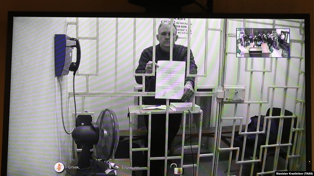 Paul Whelan is seen on a video screen during a court hearing in Moscow on November 19.