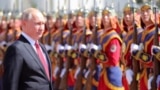 Russian President Vladimir Putin inspects a guard of honor while visiting Mongolia on September 3. 