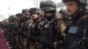 Afghan security forces stand during a ceremony to hand over security control in Badakhshan province, Faisabad, in January 2012.