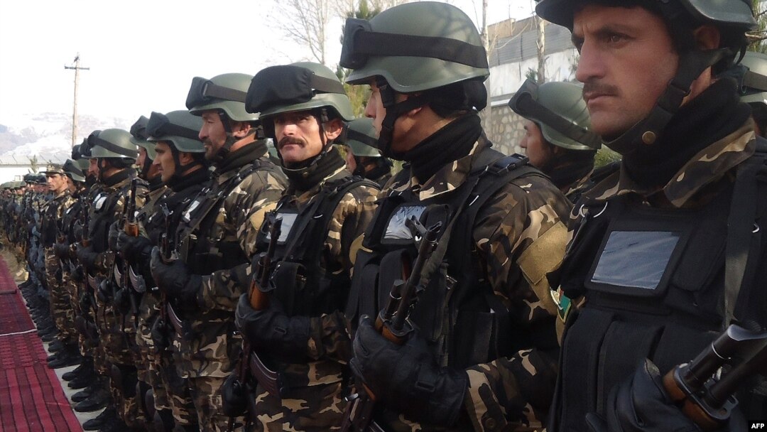 Afghan security forces stand during a ceremony to hand over security control in Badakhshan province, Faisabad, in January 2012.
