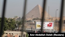 Жарылган автобустун жанындагы пирамида