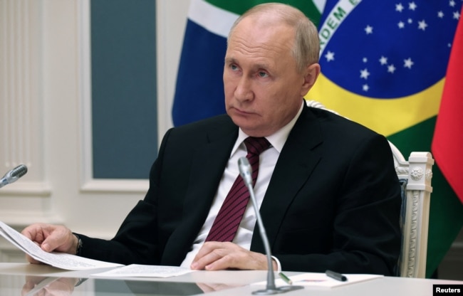 Russian President Putin attends the 2023 BRICS Summit in South Africa via video link from Moscow.