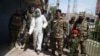 Afghan National Army personnel spray disinfectant during a lockdown in Jalalabad on April 9.