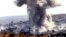 Smoke rises after an airstrike by a suspected alliance war plane on Islamic State targets in the west of Kobani on October 8.