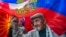 Demonstrators wave Russian and old Macedonian flags as a protest against their government's decision to expel a Russian diplomat in front of the Russian Embassy in Skopje in April.