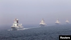 Chinese missile destroyers navigate during a joint China-Russia naval exercise in the Yellow Sea in April 2012.