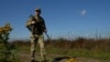 Ukraine - a guard along the border with Romania, where some draft dodgers and deserters try to leave Ukraine illegally - screen grab