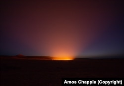 The crater glowing at dusk