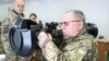 Ukraine -- Pavlo Tkachuk holds the next generation light anti-tank weapon, NLAW