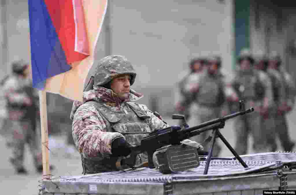 Armenian CSTO peacekeepers stationed outside a bakery in Almaty on January 11.&nbsp;