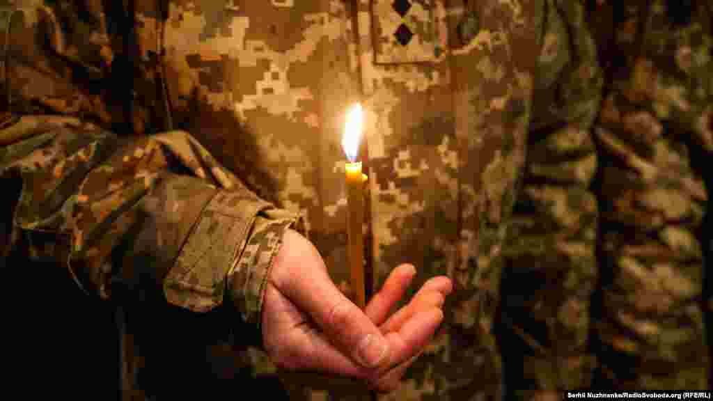 A soldier holds a candle during the ceremony. The two major battles for the Donetsk airport were fought between May 2014 and January 2015 during the early days of the war in Ukraine&#39;s eastern Donbas region between Russia-backed separatists and the Ukrainian military.&nbsp;