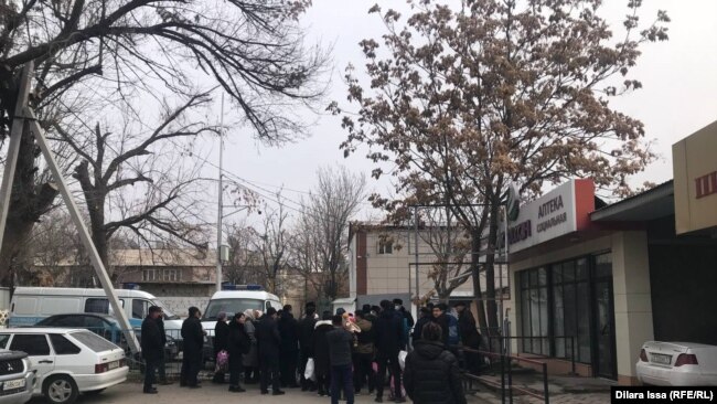 People look for their detained relatives at a detention center in Shymkent on January 10.