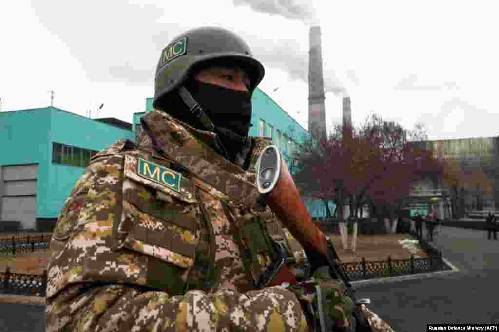 A Kyrgyz CSTO peacekeeper standing guard outside a power plant in Almaty on January 11.