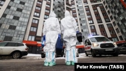 Russian medical workers prepare to make a house call to attend to a patient with symptoms of COVID-19 in St. Petersburg on January 24. 