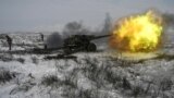 Russian Army soldiers fire a howitzer during drills at the Kuzminsky range in the southern Rostov region of Russia on January 26.