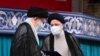 IRAN -- Iranian Supreme Leader Ayatollah Ali Khamenei, left, gives his official seal of approval to newly elected President Ebrahim Raisi in an endorsement ceremony in Tehran, August 3, 2021.