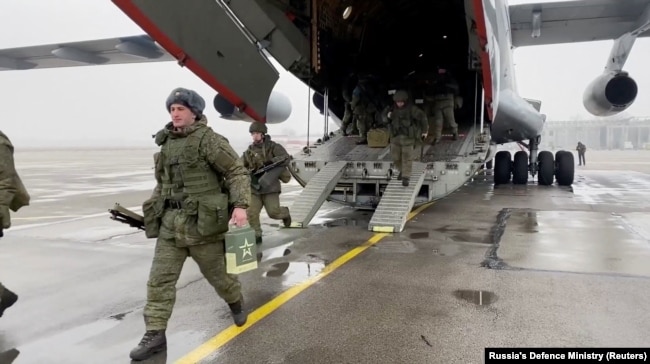 Russian soldiers disembark from a military aircraft as part of the CSTO mission at an airfield in Kazakhstan on January 7.