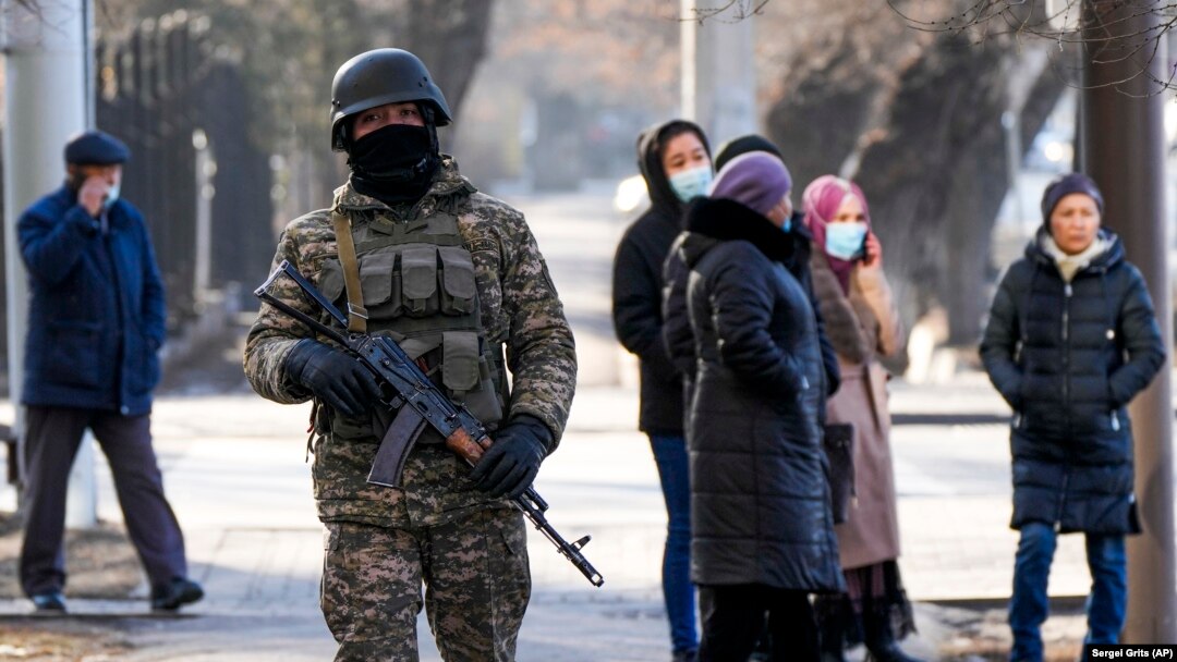 A Kazakh soldier patrols an Almaty street following deadly protests that rocked the city at the start of the year. 