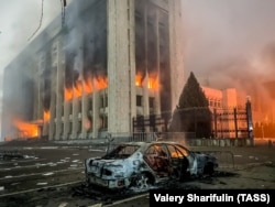 The Almaty mayor's office burns after being set ablaze by an angry mob over on January 5.