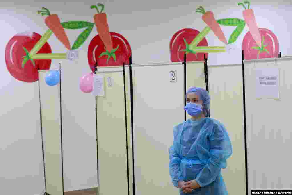 A health worker in Romania, which has initiated a COVID vaccination campaign for children aged 5-11, waits for her young patients at an inoculation center in Bucharest on January 26.&nbsp;