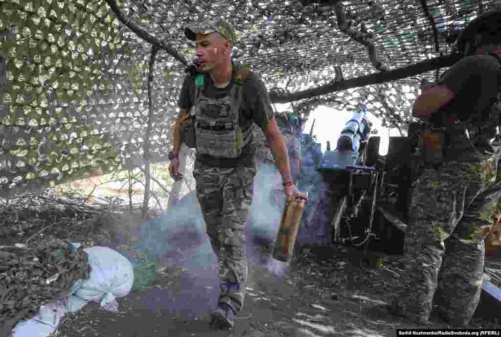 Dmytro, a member of the 15th Brigade of the Ukrainian National Guard, discards a spent shell casing after firing onto Russian positions near Pokrovsk on September 5. The city&nbsp;is a key logistical hub for the Ukrainian military, The Russian Defense Ministry reported on September 8 that its forces had captured the town of Novohrodivka, some 12 kilometers from Pokrovsk. &nbsp;