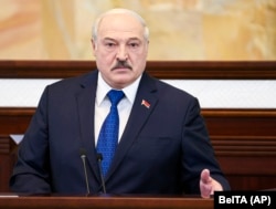 Belarusian President Alzaksandr Lukashenka addresses his country's parliament in Minsk on May 26. (file photo)