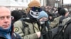 A participant covers his face during a right-wing rally in Budapest on February 8.