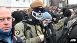 A participant covers his face during a right-wing rally in Budapest on February 8.