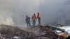 Emergency workers extinguish a fire at the site of an air strike that hit a building near the Iranian Embassy in Damascus on April 1. 