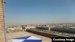 A symbol with its origins in a 1954 convention on protecting cultural sites during war has been spotted on the rooftops of buildings in Iran.