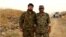 Colonel Fashad Hasounizadeh (right) was killed in southern Syria, one of three senior commanders to die there recently.