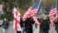 Demonstrators carry Georgian and US flags during an opposition rally in Tbilisi. (file photo)