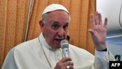 Pope Francis talks to journalists on his flight back to Rome following a visit to Armenia on June 26.