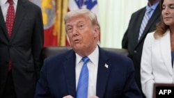 US President Donald Trump speaks during a signing ceremony for the "Secure America Act" in the Oval Office of the White House in Washington, DC, on June 10, 2026.