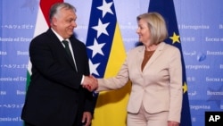 Hungarian Prime Minister Viktor Orban meets with Borjana Kristo, the chairwoman of Bosnia-Herzegovina's Council of Ministers, in Sarajevo on April 4. 