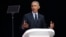 Former U.S. President Barack Obama, left, delivers his speech at the 16th Annual Nelson Mandela Lecture at the Wanderers Stadium in Johannesburg, South Africa, Tuesday, July 17, 2018.