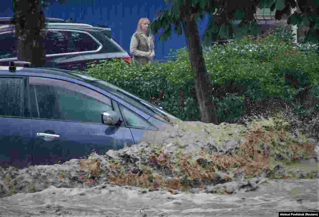 A car is inundated following heavy rainfall in Yalta, Crimea, on June 18.