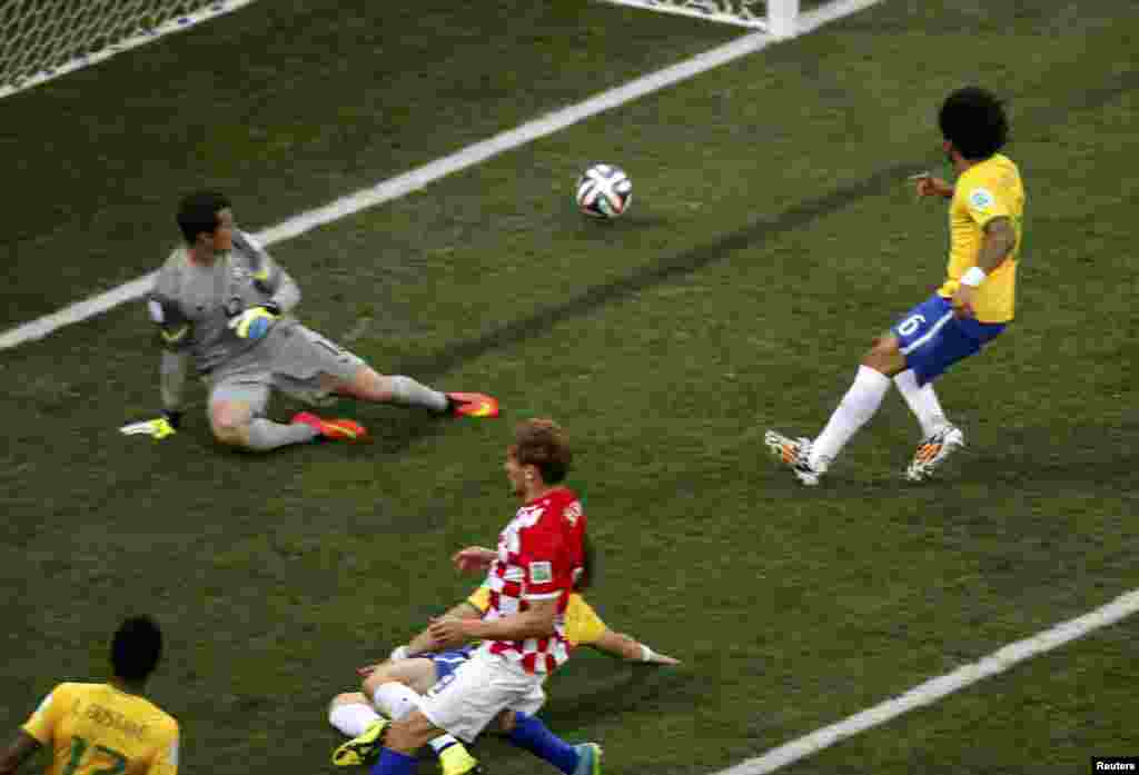 Brazil -- Brazil's Marcelo (R) scores an own goal during the 2014 World Cup opening match between Brazil and Croatia at the Corinthians arena in Sao Paulo June 12, 2014