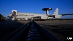 A NATO air-surveillance aircraft sits on the tarmac on September 19 ahead of a flight over Polish airspace, part of the alliance's Eastern Sentry mission.