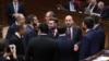 Armenia - Deputies from the ruling Civil Contract party talk on the parliament floor, Yerevan, April 15, 2025.