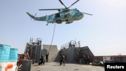 Russia and Iran have long had close relations. Here, members of both militaries participate in a joint exercise in February.