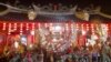 Soldiers perform a dragon dance in front of Tay Kei Sek temple in Semarang in central Java in Indonesia.