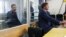 Russian citizen Maksim Odintsov (left) in a Kyiv court in 2017