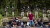 POLAND/BELARUS - A member of a group of migrants believed to be from Afghanistan stands as he tries to confirm their will to apply for international protection in Poland in the presence of Polish volounteer lawyers, press members and Polish Parliament dep