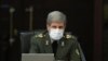 IRAN -- Iranian Defense Minister Brigadier General Amir Hatami wears a protective mask and gloves as means of protection against the cornonavirus COVID-19, during a cabinet meeting in the capital Tehran, March 11, 2020