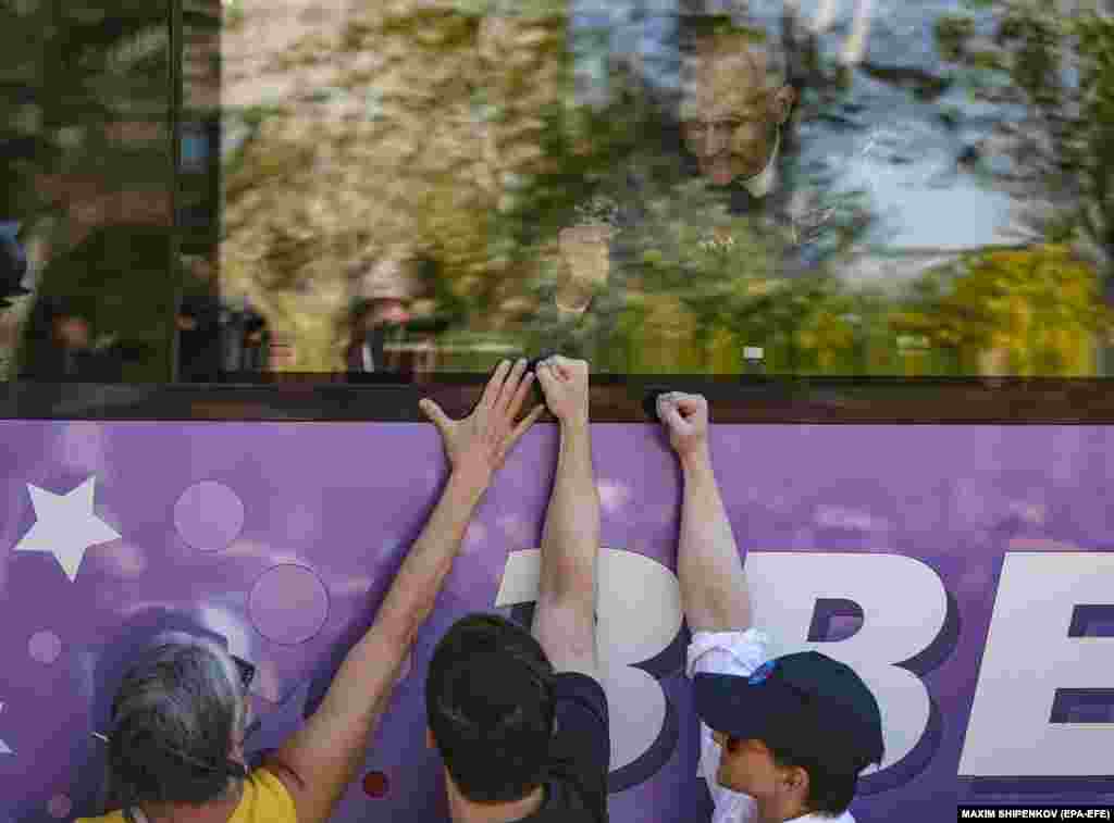 NASA astronaut Don Pettit, a crew member of the International Space Station, gestures as he leaves a hotel and boards a bus during a send-off ceremony before launch at the Baikonur Cosmodrome in Kazakhstan on September 11.